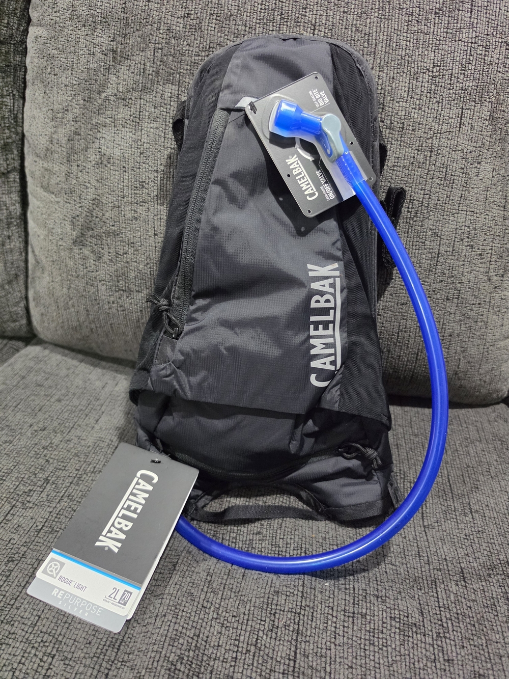 Camelbak Black Backpack with Bright Blue Hydration Tube